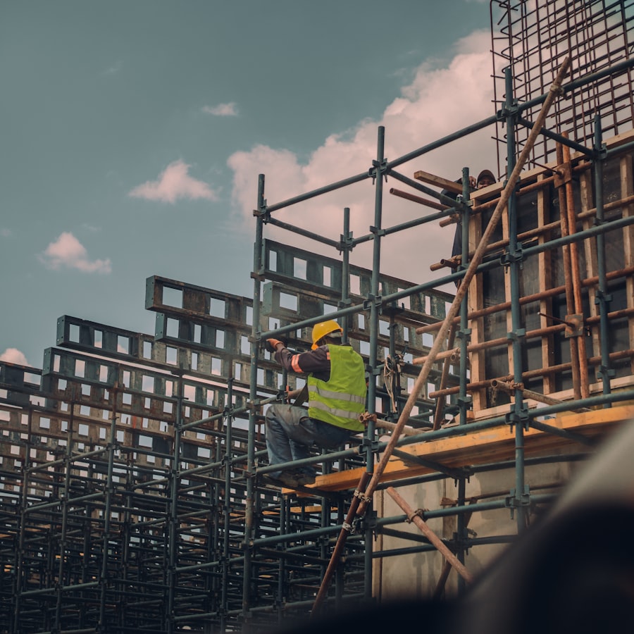 Worker in high visibility clothing on a scaffolded site